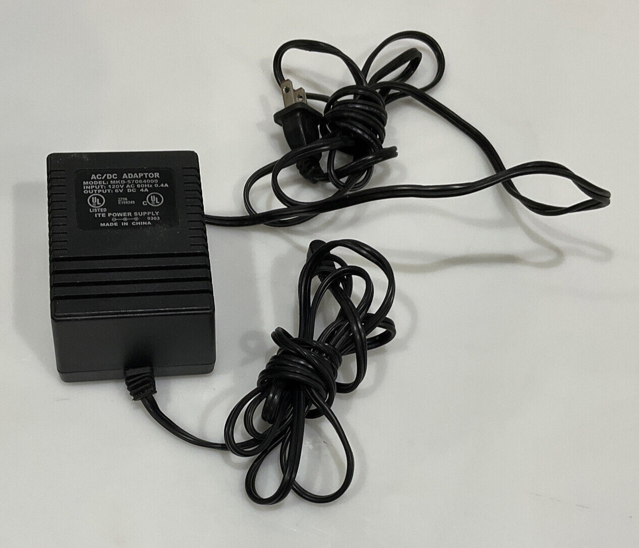 AC/DC ADAPTOR MKD-57064000 120V AC 60HZ 0.4A 6V DC 4A